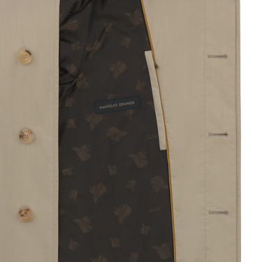 Interior lining of Sealup beige raincoat with branded pattern and label 'NAVIGLIO GRANDE', emphasizing luxury and quality finish.