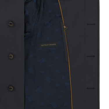 Interior view of Sealup raincoat showing navy lining with Namglo Grande label and yellow trim, combining elegance and utility.