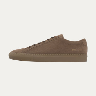 Lateral view of Common Projects Achilles Tonal sneaker 2478 9417 with gold foil serial number detail and dark brown suede upper.