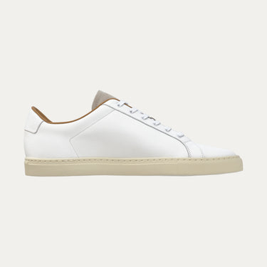 Side profile of Common Projects Retro Low 2480 0506 sneaker in white leather with beige rubber sole, part of SS25 collection.