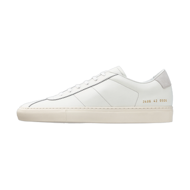 Common Projects 'Tennis Classic' sneaker featuring signature gold serial number 2486 0506 on the heel, crafted in premium white leather.