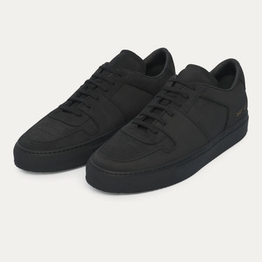 Common Projects 'Decades' Nubuck Leather Sneaker in Black with minimalist design and tonal stitching, available at SARTALE for SS25.