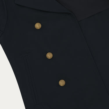 Close-up of Sealup Amalfi Peacoat's gold buttons and front pocket detailing, highlighting luxury design in navy blue outerwear.