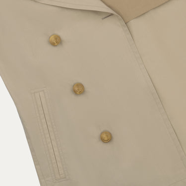 Close-up of Sealup Amalfi Peacoat in Beige highlighting gold-tone buttons and welt pocket. Elegant detailing from the SS25 outerwear collection.