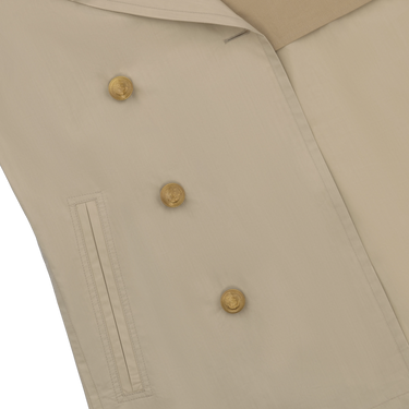Close-up of Sealup Amalfi Peacoat in Beige highlighting gold-tone buttons and welt pocket. Elegant detailing from the SS25 outerwear collection.