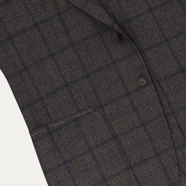 Close-up of Orazio Luciano jacket front pocket and check pattern, highlighting fine wool texture and craftsmanship details.