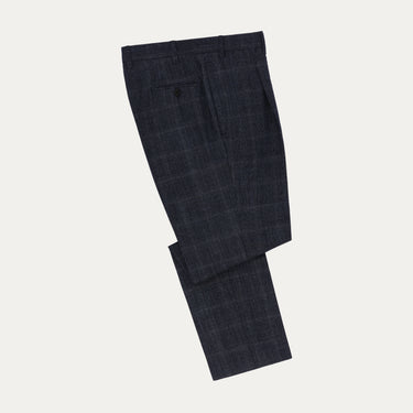 Orazio Luciano dark blue Prince of Wales wool suit trousers folded neatly, part of a luxury two-piece suit perfect for winter and formal occasions.