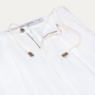 Close-up of Richard J. Brown Caprera Trousers in White, showcasing drawstring waist and zip closure. Premium summer trousers available at SARTALE.