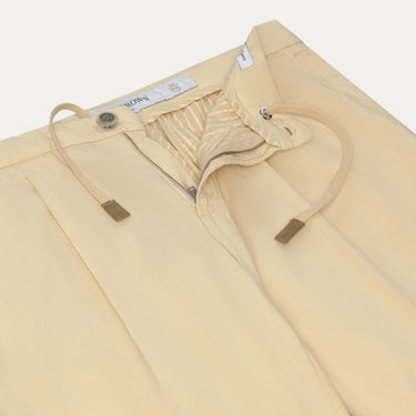 Close-up of Richard J. Brown Caprera Trousers in Cream showing drawstring waist, zip fly, and refined stitching. Part of SARTALE's trouser collection.