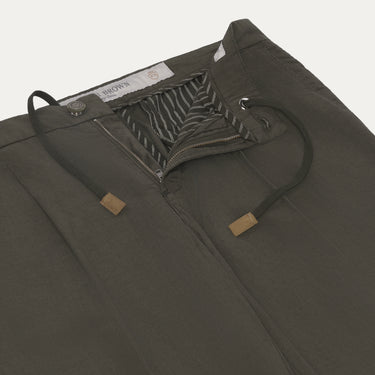Close-up of Richard J. Brown Caprera Trousers in Dark Green showing drawstring waist and striped inner lining. Premium summer style at SARTALE.