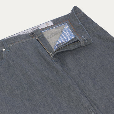 Close-up of Richard J. Brown Blue Melange Jeans zipper and waistband, highlighting premium stitching and gingham inner lining. Designed for comfort and style.