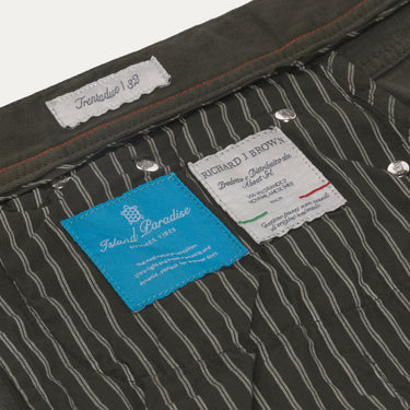 Interior label details of Richard J. Brown Regular-Fit 5 Pocket Jeans in Dark Green, showing brand tags and striped lining.