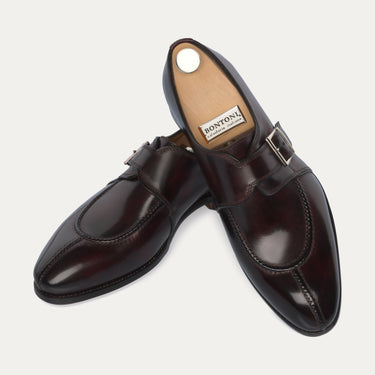 Top and side view of Bontoni 'Magnifico Single-Monk' loafer in burgundy, showcasing premium leather and detailed apron stitching. Luxury men's footwear.