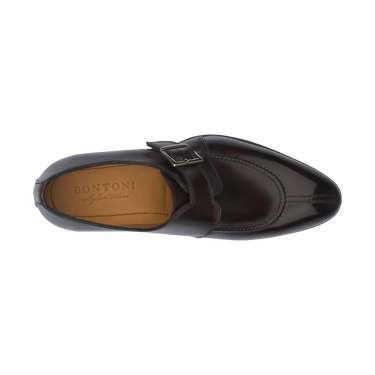Overhead view of Bontoni 'Magnifico Single-Monk' loafer in burgundy, highlighting the hand-stitched split-toe apron and branded insole. Elegant craftsmanship.