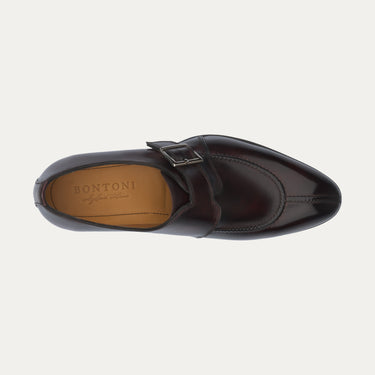 Overhead view of Bontoni 'Magnifico Single-Monk' loafer in burgundy, highlighting the hand-stitched split-toe apron and branded insole. Elegant craftsmanship.