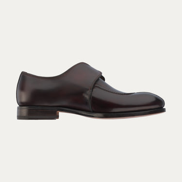 Inner side profile of Bontoni 'Magnifico Single-Monk' loafer in burgundy, featuring sleek leather construction and low stacked heel. Refined Italian design.
