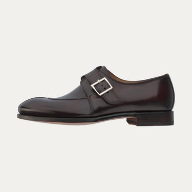 Outer side profile of Bontoni 'Magnifico Single-Monk' loafer in burgundy with silver buckle and apron toe detail. Sophisticated men's dress shoe.