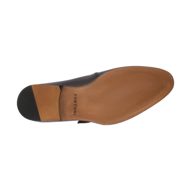 Sole view of Bontoni 'Magnifico Single-Monk' loafer in burgundy, showing smooth leather outsole with Bontoni branding. High-end Italian shoe craftsmanship.