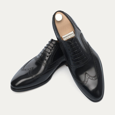 Elegant Bontoni Libertino no Fiore Oxfords in black leather, featuring brogue accents and premium craftsmanship for Sartale's Spring/Summer 25 lineup.