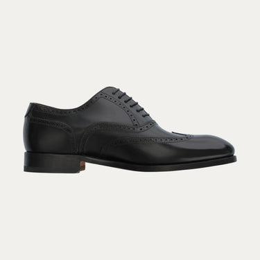 Side profile of Bontoni Libertino no Fiore black Oxford shoe with classic wingtip and perforated design, part of Sartale's MidSeason25 collection.
