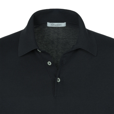 Close-up of Cruciani cotton-silk polo shirt collar and buttons in dark blue, highlighting premium craftsmanship and minimalist design.