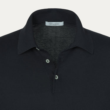 Close-up of Cruciani cotton-silk polo shirt collar and buttons in dark blue, highlighting premium craftsmanship and minimalist design.