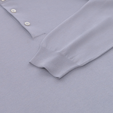 Detail of Cruciani Cloudy Blue Cotton-Silk Polo Shirt sleeve and buttons, emphasizing fine ribbed cuff and elegant fabric finish.