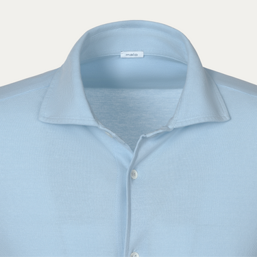 Close-up of Malo Jersey Cotton Shirt collar in Light Blue, highlighting soft jersey texture and minimalist design for modern menswear.