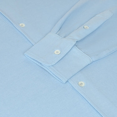 Detail of Malo Jersey Cotton Shirt cuff and sleeve buttons in Light Blue, emphasizing fine stitching and luxury craftsmanship.