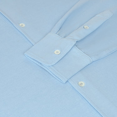 Detail of Malo Jersey Cotton Shirt cuff and sleeve buttons in Light Blue, emphasizing fine stitching and luxury craftsmanship.