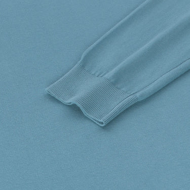 Detailed view of Malo pullover sleeve cuff in light blue, emphasizing ribbed finish and soft cotton texture from SS25 collection.