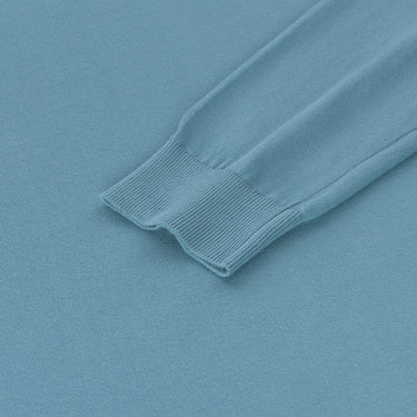 Detailed view of Malo pullover sleeve cuff in light blue, emphasizing ribbed finish and soft cotton texture from SS25 collection.