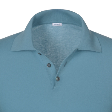 Close-up of Malo polo shirt collar and button placket in light blue cotton, highlighting premium craftsmanship and minimalist design.