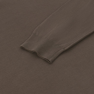 Detailed view of ribbed cuff on Malo brown cotton long sleeve polo shirt, emphasizing craftsmanship and soft knit fabric.