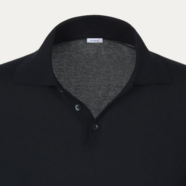 Close-up of Malo polo shirt collar and button placket in dark blue, highlighting fine stitching and luxury knitwear craftsmanship.