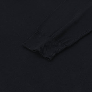 Detailed view of the ribbed cuff on Malo dark blue cotton long sleeve polo shirt, emphasizing quality and comfort.