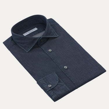 Richard J. Brown cotton denim dark blue shirt neatly folded with visible collar and cuff, ideal for smart-casual summer wear.