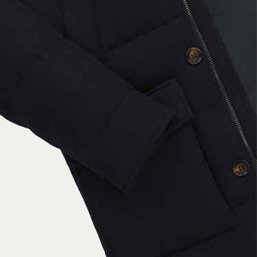 Detailed sleeve and pocket view of Kired Hooded Down Winter Jacket in Blue, emphasizing ribbed cuff and premium stitching.