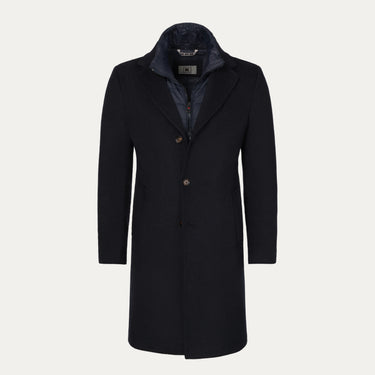 Abrigo con capucha en azul oscuro con inserción desmontable de protección contra el viento