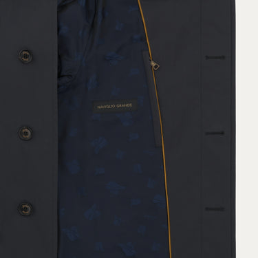 Interior view of Sealup raincoat showing navy lining with Namglo Grande label and yellow trim, combining elegance and utility.