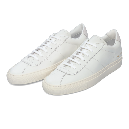 Common Projects 2486 0506 'Tennis Classic' white leather sneakers with minimalist design and premium stitching, available at SARTALE.