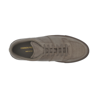 Top view of Common Projects 'Decades' grey nubuck leather sneaker, showcasing premium Italian craftsmanship and perforated toe detail.