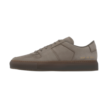 Lateral view of Common Projects 'Decades' sneaker in grey nubuck with signature gold foil serial number and sleek silhouette.