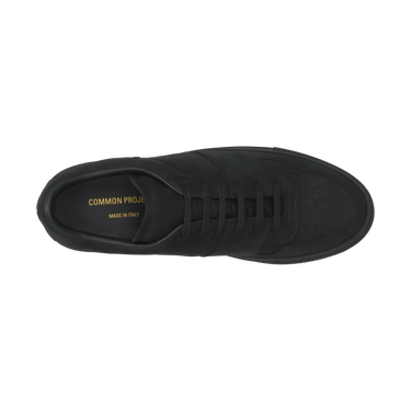 Top view of Common Projects 2487 7547 sneaker in black nubuck leather, showcasing perforated toe and gold branding inside.