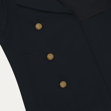 Close-up of Sealup Amalfi Peacoat's gold buttons and front pocket detailing, highlighting luxury design in navy blue outerwear.