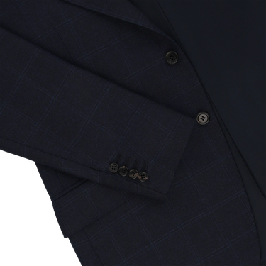 Detail of sleeve and buttons on Orazio Luciano navy wool suit jacket with subtle check pattern. Crafted for timeless sophistication in men’s fashion.