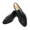 «Bellantonio» Six-Eyelet Leather Oxford Shoes with Perforated Details and Medallion in Nero Black