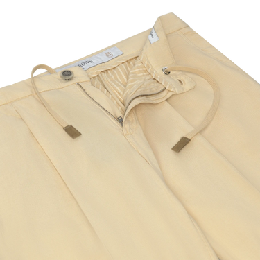 Close-up of Richard J. Brown Caprera Trousers in Cream showing drawstring waist, zip fly, and refined stitching. Part of SARTALE's trouser collection.