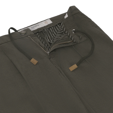 Close-up of Richard J. Brown Caprera Trousers in Dark Green showing drawstring waist and striped inner lining. Premium summer style at SARTALE.