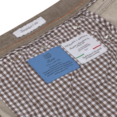 Interior label and lining detail of Richard J. Brown Regular-Fit 5 Pocket Jeans in Brown Melange, featuring Italian craftsmanship and comfort tags.